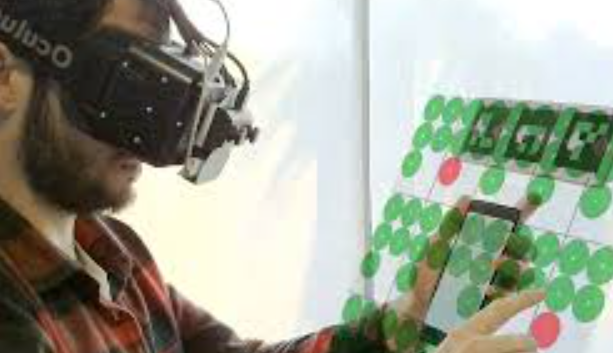 Enlarging a Smartphone with AR to Create a Handheld VESAD (Virtually Extended Screen-Aligned Display)