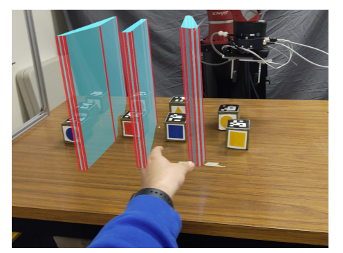 Improving Human Legibility in Collaborative Robot Tasks through Augmented Reality and Workspace Preparation